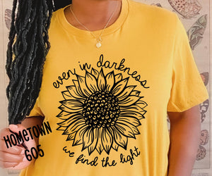 Even in the darkness, we find the light t-shirt, graphic tee